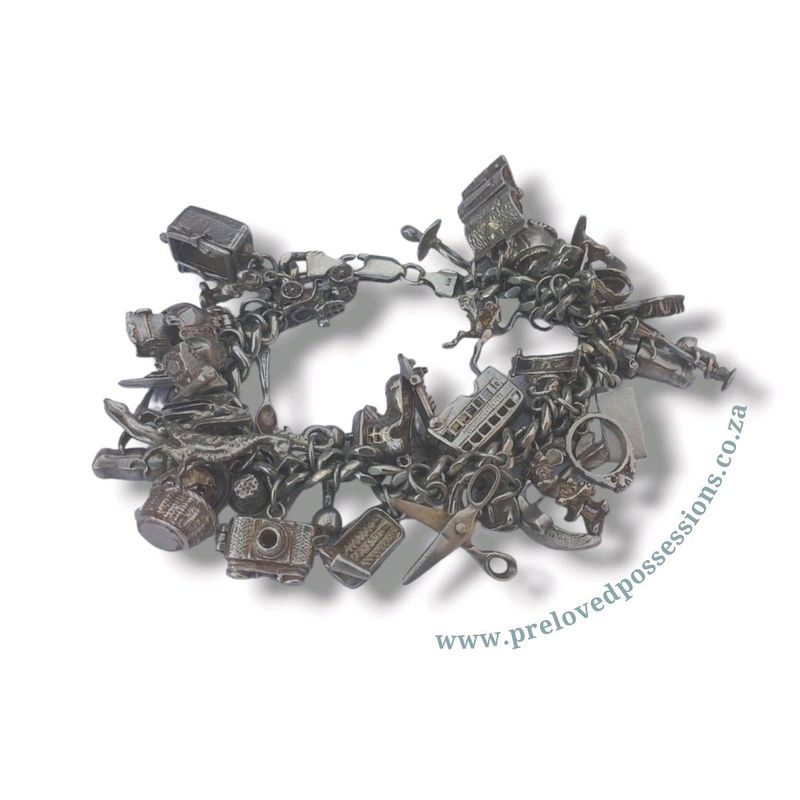 Silver bracelet with 36 charms (charms can be bought separately)