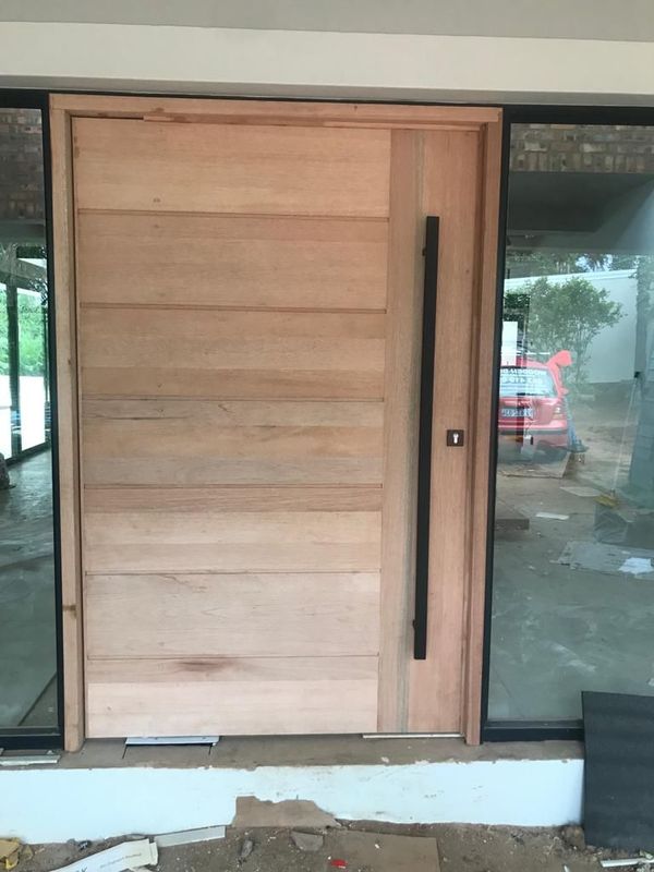 Pivot doors Umhlanga, door hanging and repairs Durban North, skirtings, wooden windows, Carpenter