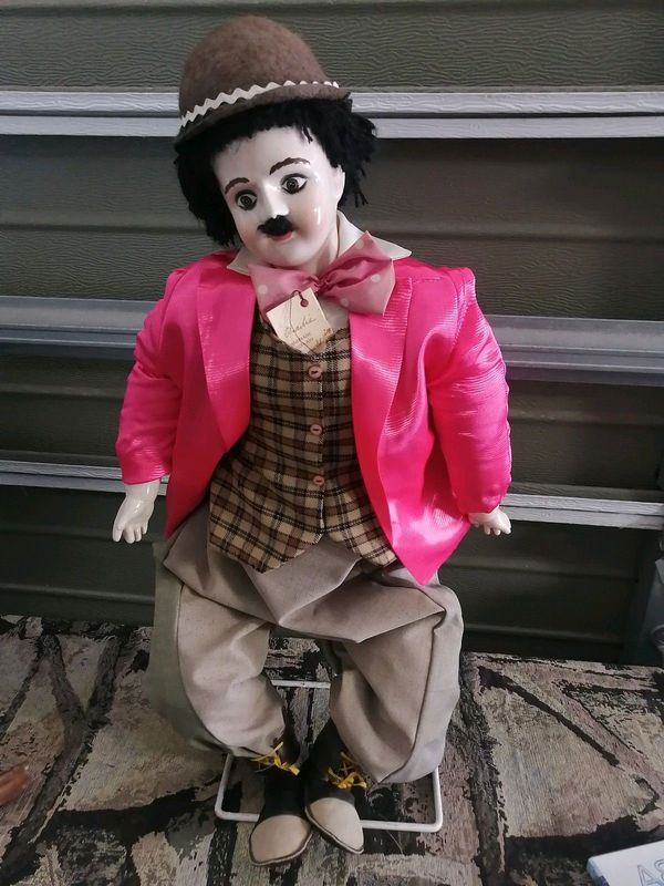 Collectible Charlie Chaplin porcelaine doll with stand