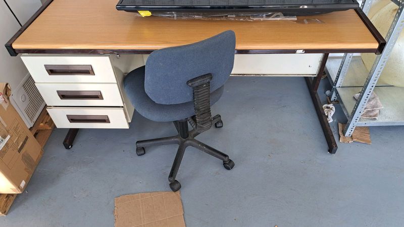 Office desk with swivel chair