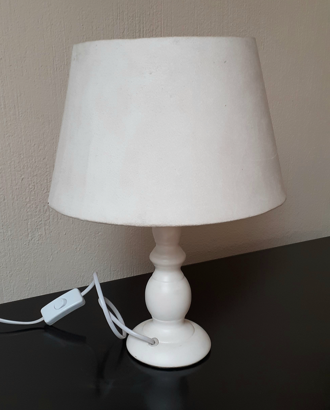 Lamp with suede shade.