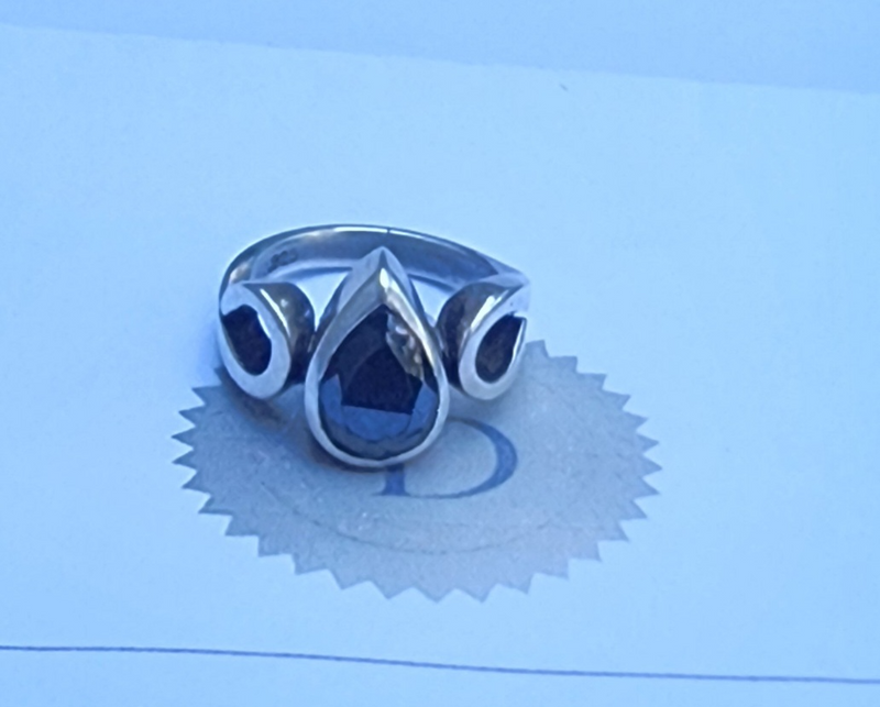Silver ring with a black diamond