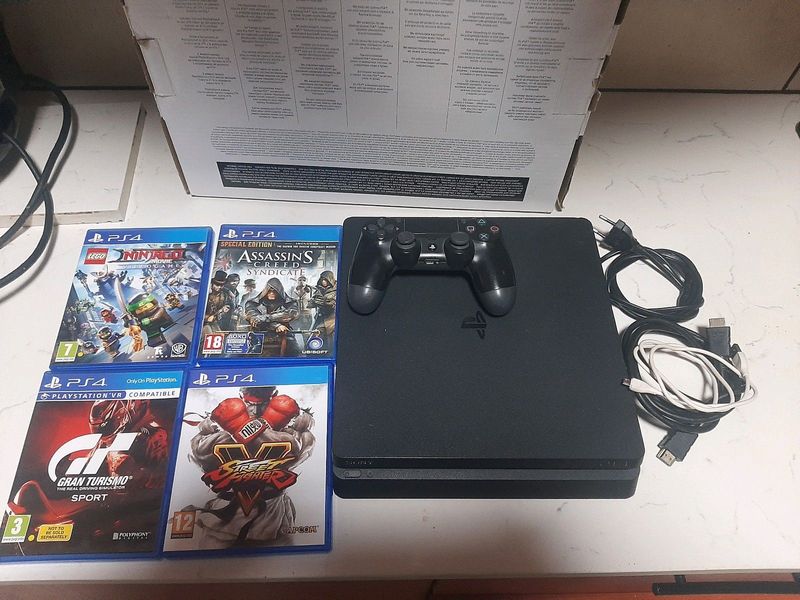 Playstation 4 slim with 4 games and box
