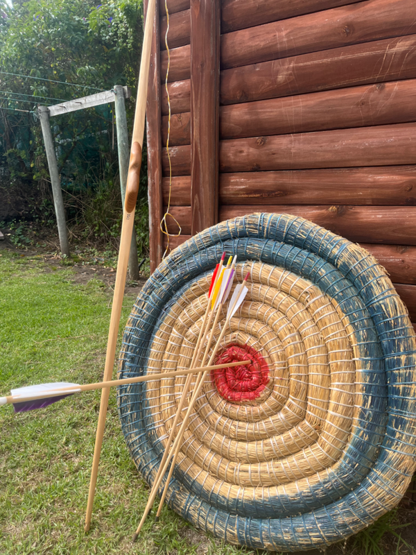 Handmade bow and arrows with target