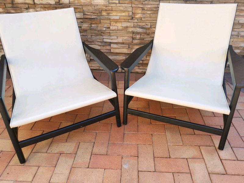 Cream large leather loungers in excellent condition.