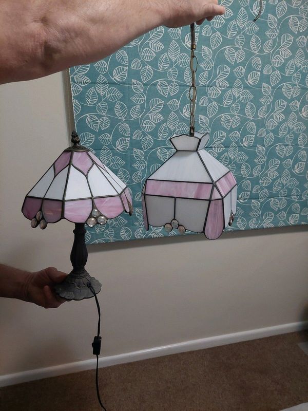 Stained glass beside lamp and matching hanging ceiling light
