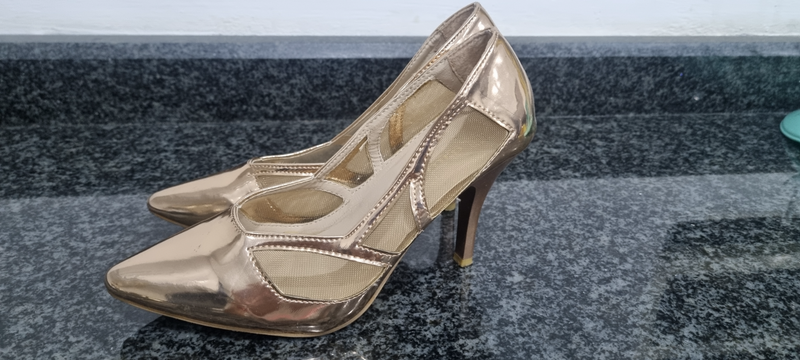 Rose gold heeled shoe