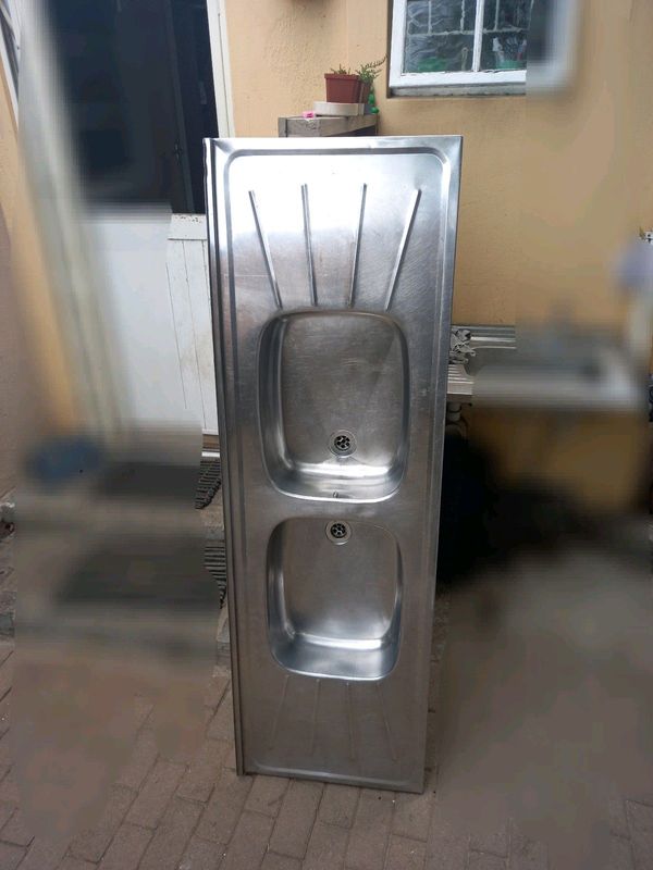 Double bowl sink with PVC outlet pipe