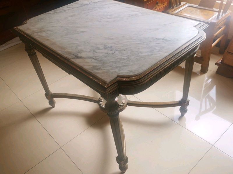 A beautiful marble top six seater dinning table/center table.