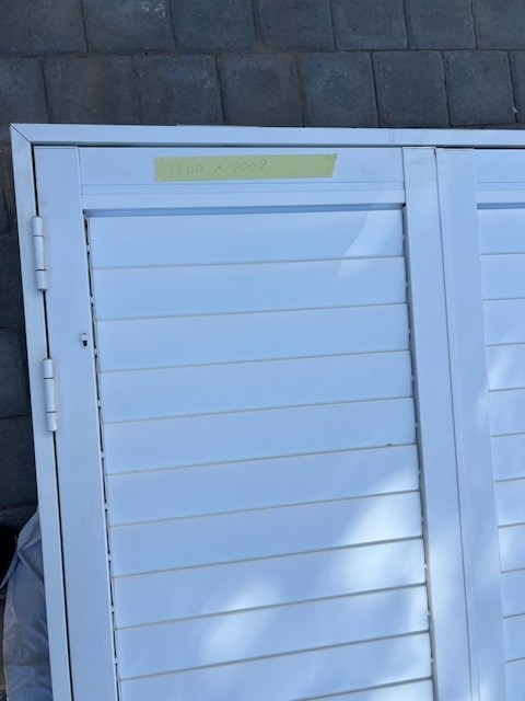 White hurricane shutters in immaculate condition