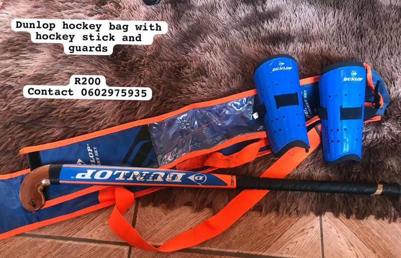 Dunlop hockey bag with hockey stick and guards