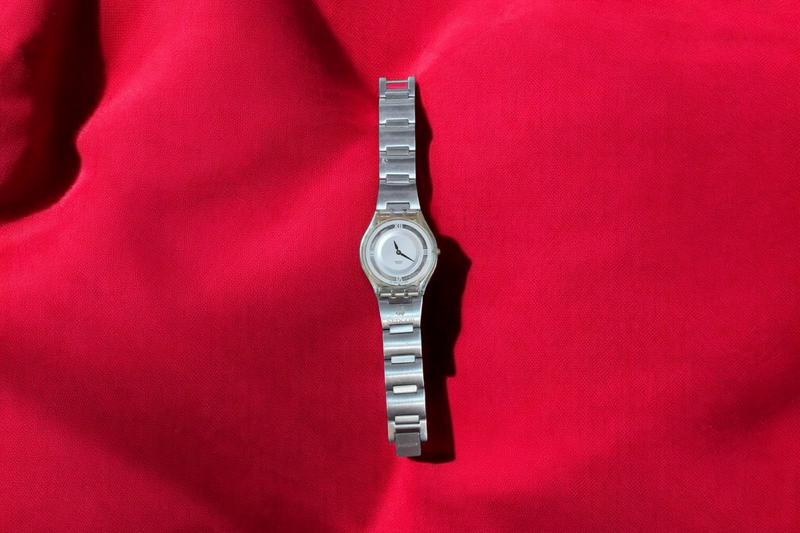 Swatch Nedcor watch featuring elegant Roman numerals this exquisite piece