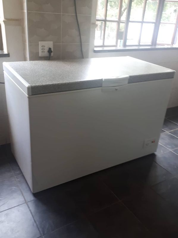 White and grey Defy freezer. 380 litres