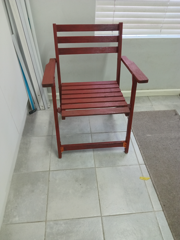 Folding wooden arm chair