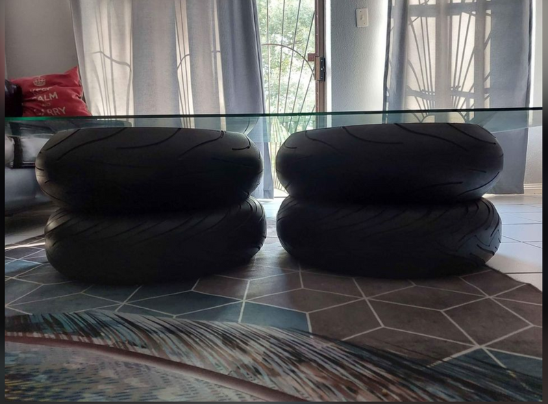 Glass coffee table top with tyres as a base
