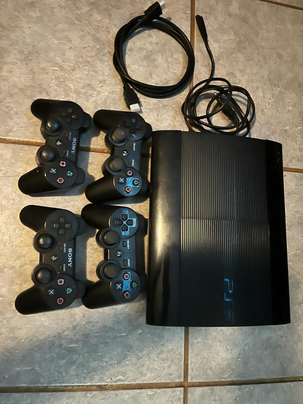 Playstation 3 with 4 controllers and 49 games