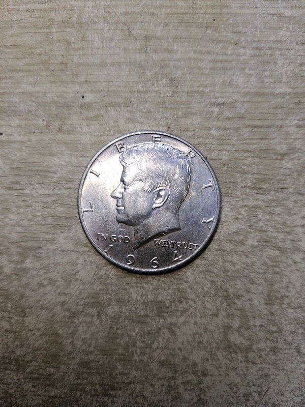 1975 AU Silver Kennedy 1/2 Dollar.