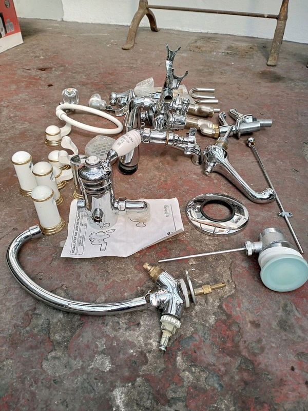 Britannia shower mixer, Victoria style bath taps and various other taps and parts. New