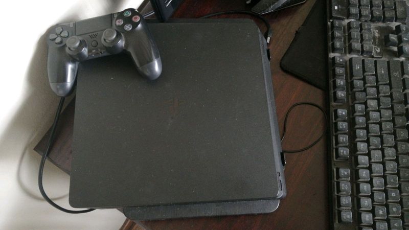Playstation 4 slim 500gb plus remote plus 1tb external hardrive hardrive is brand new