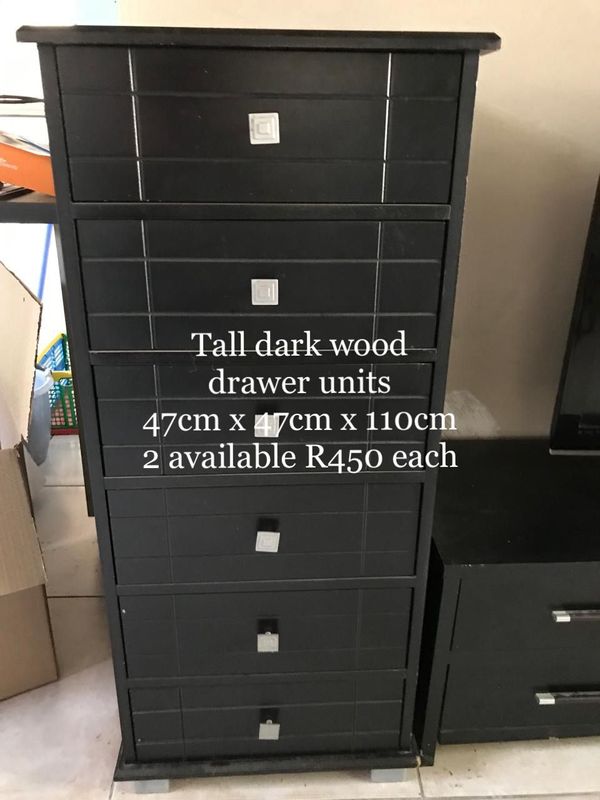 Tall dark wood drawer units