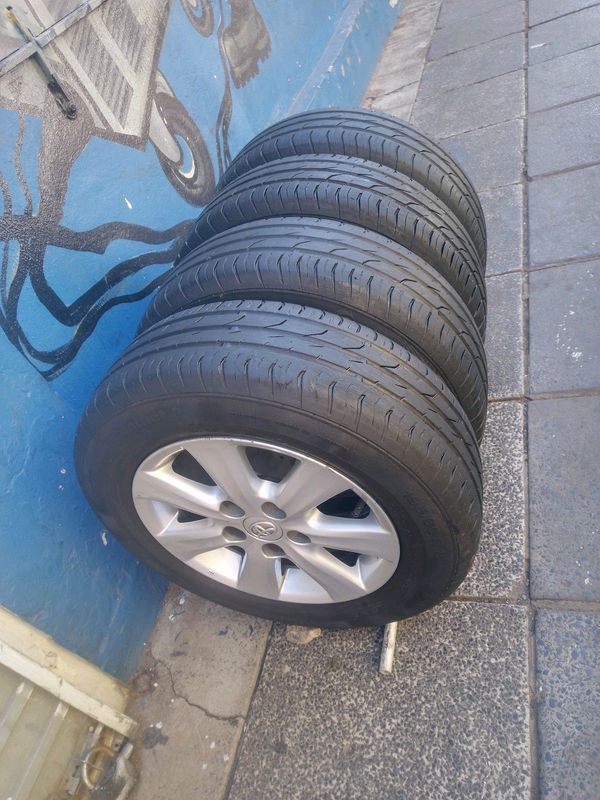 A Set of 15inches Toyota Corolla Rims And TYRES