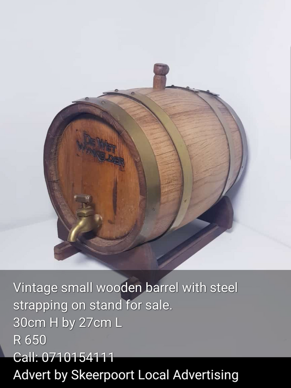 Vintage small wooden barrel with steel strapping for sale