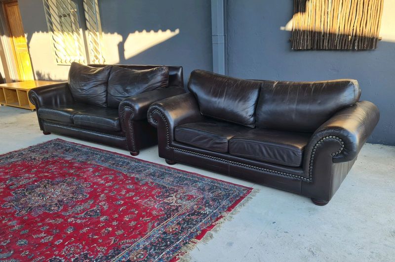 GORGEOUS OXBLOOD GENUINE LEATHER STUDDED SOFAS, R7500 EACH - SOL