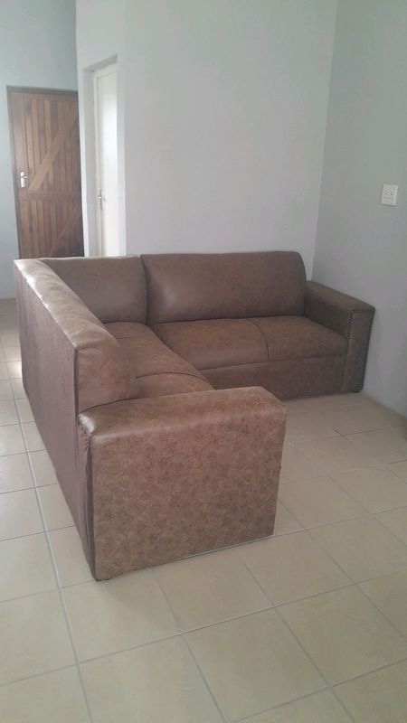 L shaped light brown leather couches