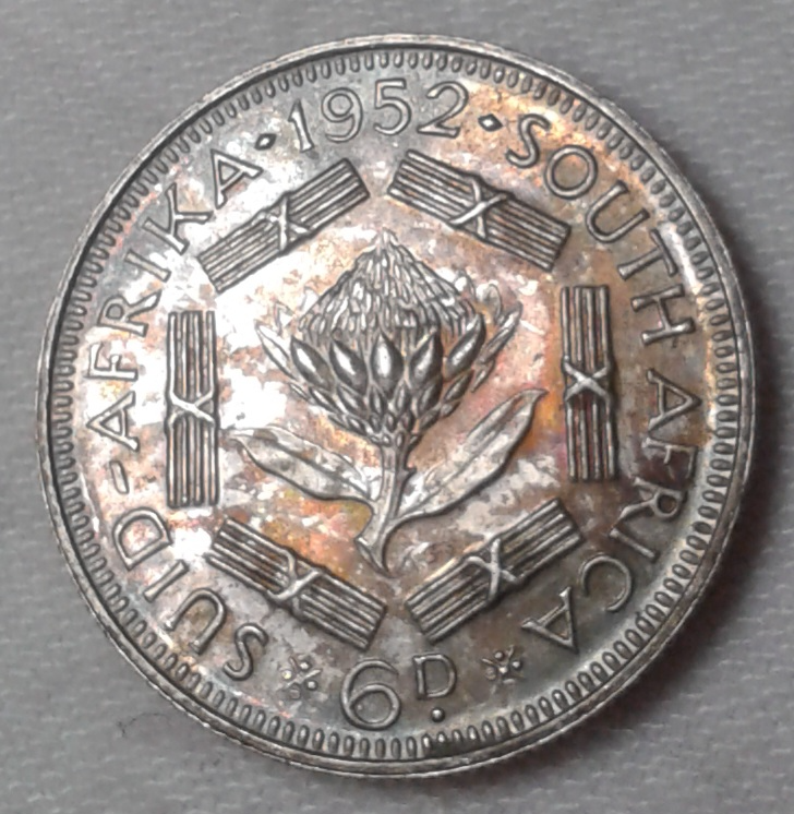 Nice 1952 S.A proof silver sixpence with iridescent toning