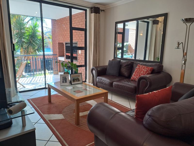 Stunning first floor, two bed, one bathroom apartment set well back from Rivonia road.