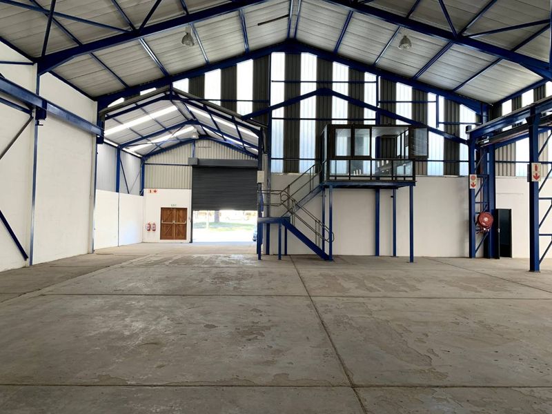 Refurbished modern factory or warehouse with cranes and great exposure