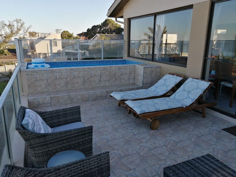 Enjoy sea views from this five bedroom home close the beaches of Glenmore Beach