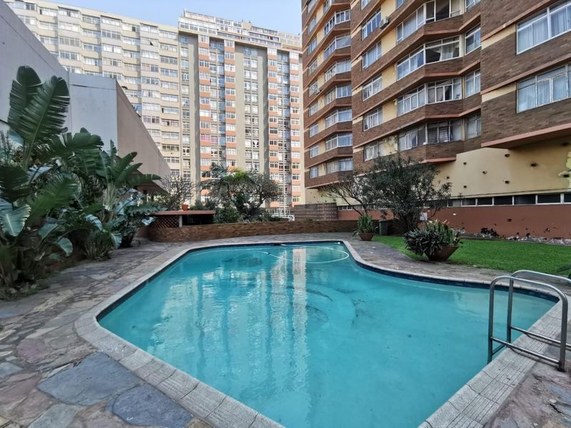 LUXURIOUS 2 BEDROOM 2 BATHROOM UNDER COVER PARKING AND POOL