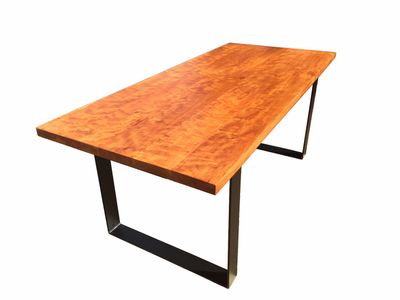 Variety of Different wood tables with hoop legs