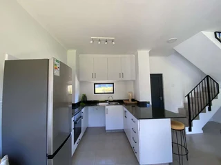 Modern 2-Bedroom Townhouse with Private Garden in The Woods Estate