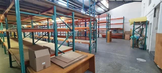 Warehouse with good height,high roller shutter entrance situated 24-hour security park in Diep River