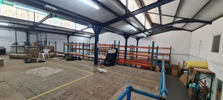 Warehouse with good height,high roller shutter entrance situated 24-hour security park in Diep River