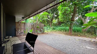 Modern fully furnished 2-bedroom apartment with a private lush garden!