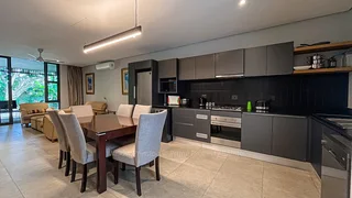 Modern fully furnished 2-bedroom apartment with a private lush garden!