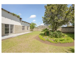 **Charming Sandstone and Plaster Family Home with Ample Space and Modern Amenities**