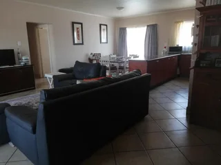 Modern 3 - Bedroom Apartment with Built-in Braai and Communal Swimming Pool!