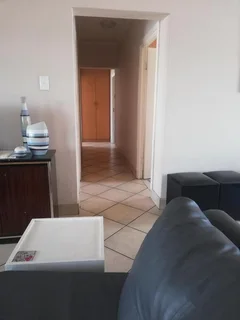 Modern 3 - Bedroom Apartment with Built-in Braai and Communal Swimming Pool!