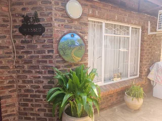 Charming Face-Brick Family Home with Modern Amenities and Exceptional Security