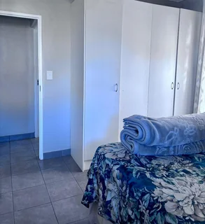 **Spacious 3-Bedroom with build in cupboards in secure community,with added seabreeze***