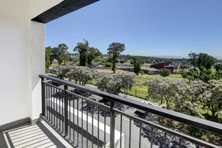 Secure North-Facing Two-Bedroom Apartment with Balcony, Views &amp; Tandem Basement Parking