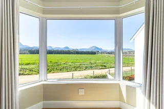 Luxurious 5-Bedroom Home with Exceptional Vineyard &amp; Mountain Views – Nooitgedacht Village