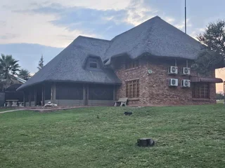 Double storey four bedroom thatch house on the banks of the Vaalriver