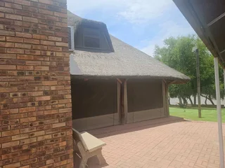 Double storey four bedroom thatch house on the banks of the Vaalriver