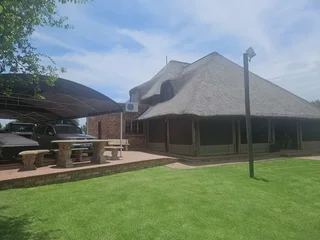 Double storey four bedroom thatch house on the banks of the Vaalriver