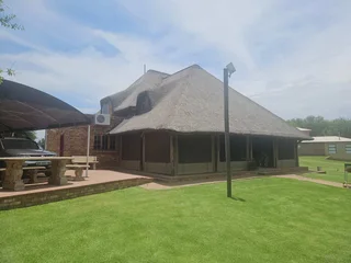 Double storey four bedroom thatch house on the banks of the Vaalriver